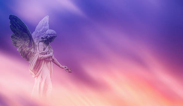 Beautiful angel in pink and blue sky concept of religion
